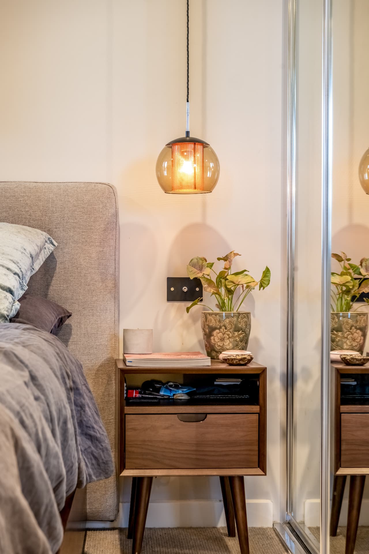 Bedroom with pendant lighting and mirrored robes