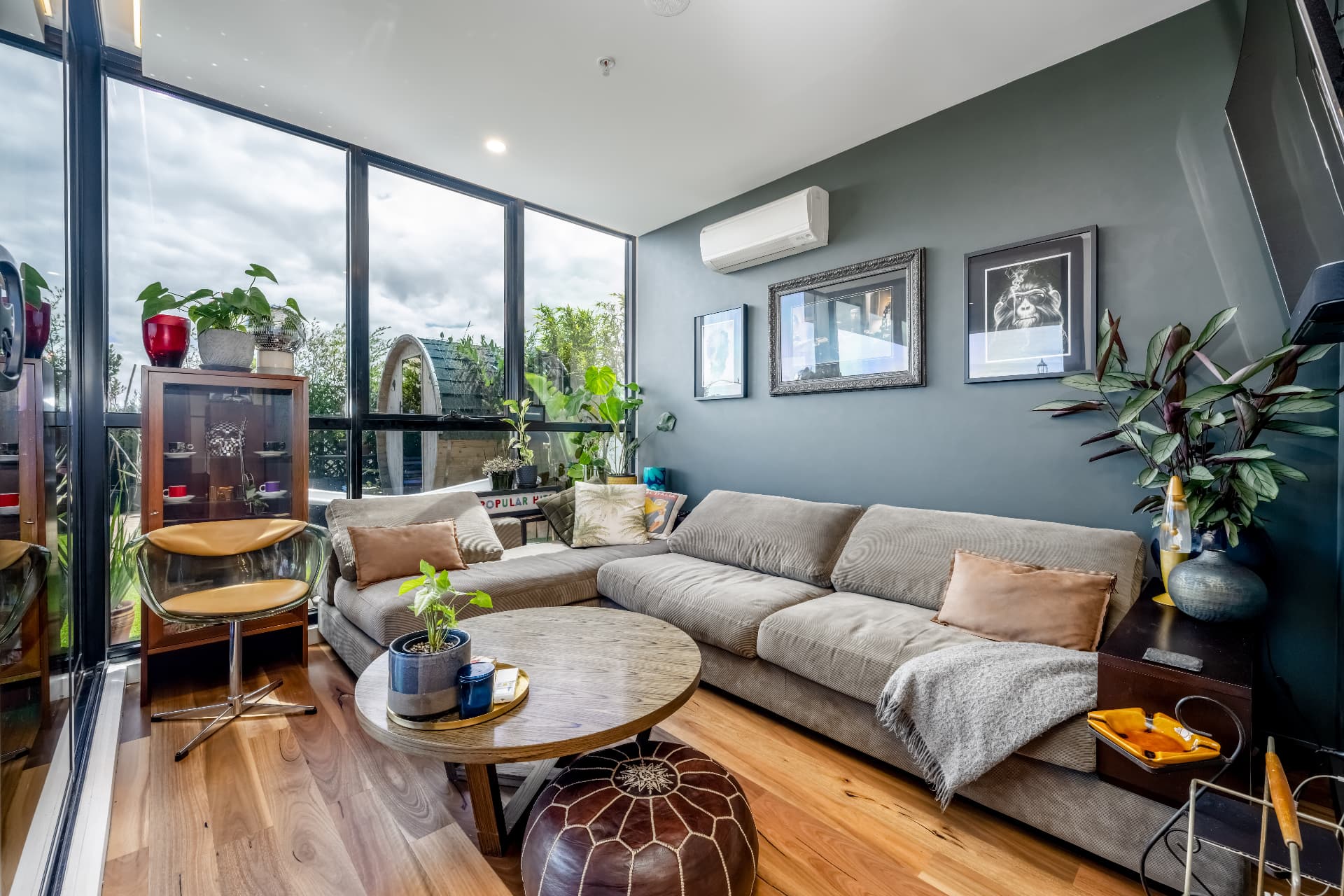 Living room with full-height glass opening to the terrace
